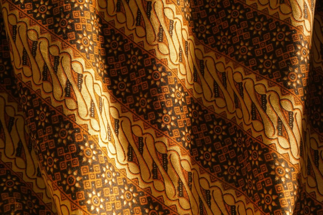 Detail of a brown and cream batik fabric pattern